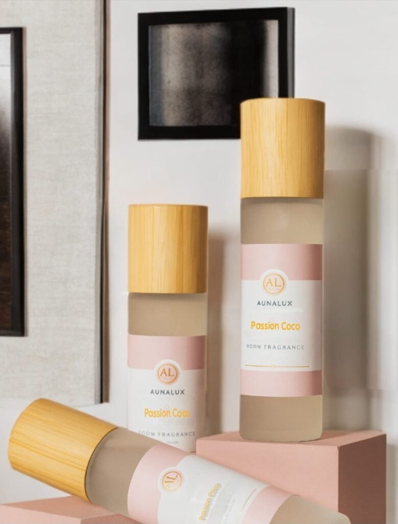 AunaLux Passion Coco room fragrance bottles with wooden caps displayed on modern interior shelf